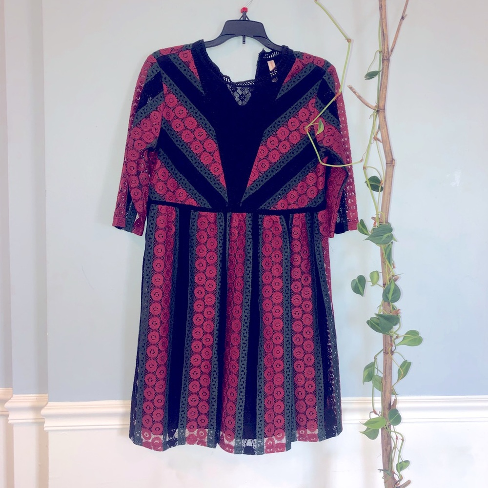 A line dress in red black & green with crochet lace details, very breathable. M.